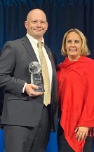 Police Chief Ronald Sellon (pictured with his wife, Jenifer Sellon) of the Mansfield Police department accepts the Community Policing award from IACP in Chicago.